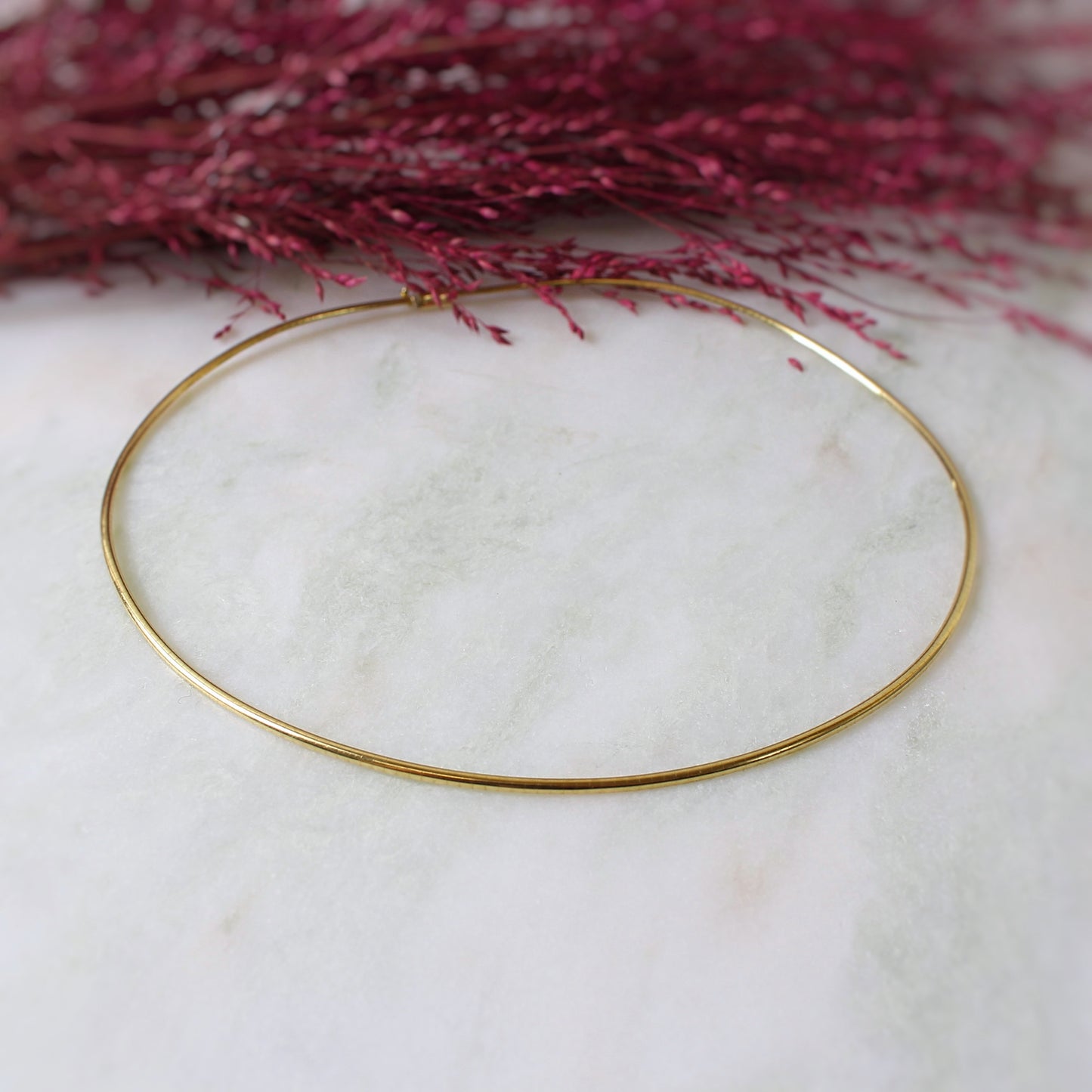 Collier femme souple maille oméga en or jaune 18K.